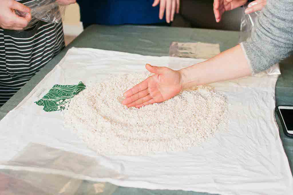 Hand touching rice