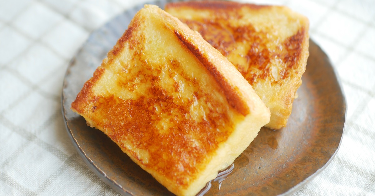 Two pieces of french toast made with shokupan on a plate