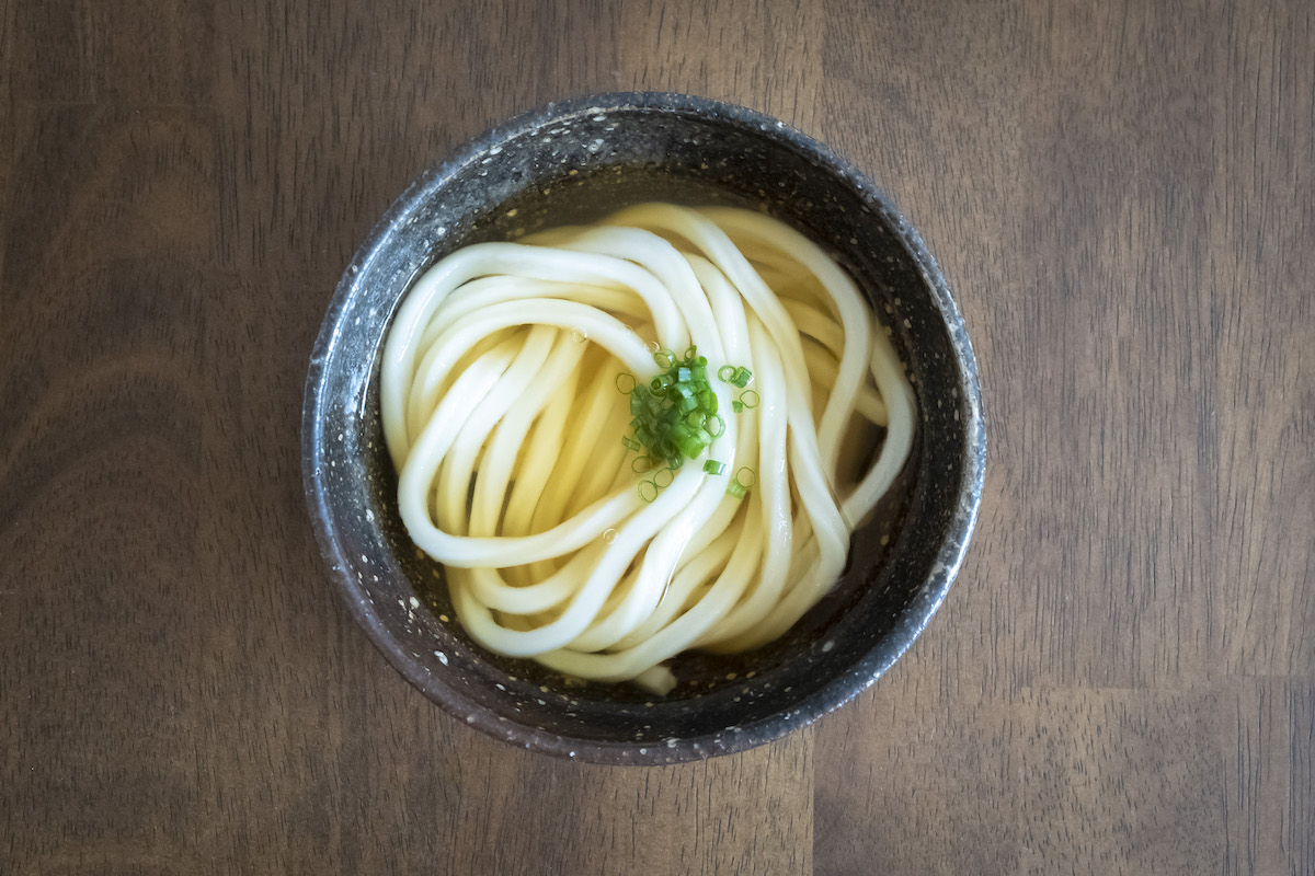 Udon with green onions in a bowl